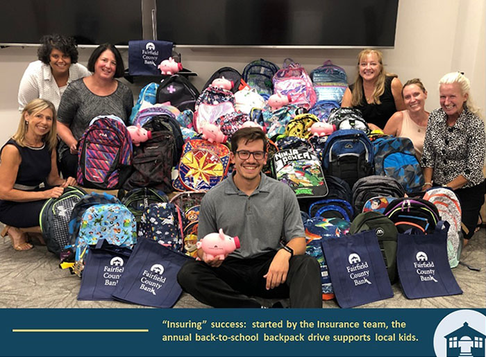 Insuring success: started by the insurance team, the annual back-to-school backpack drive supports local kids.